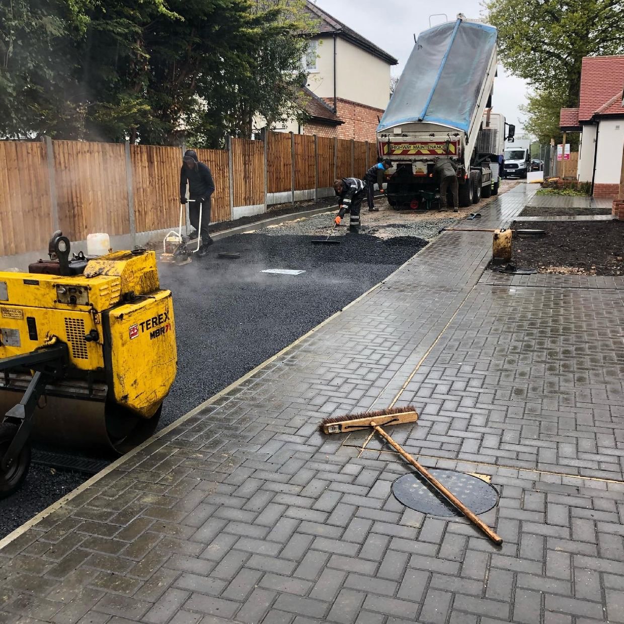 Tarmac being laid and rolled by the Ideal Landscapes crew, work in progress
